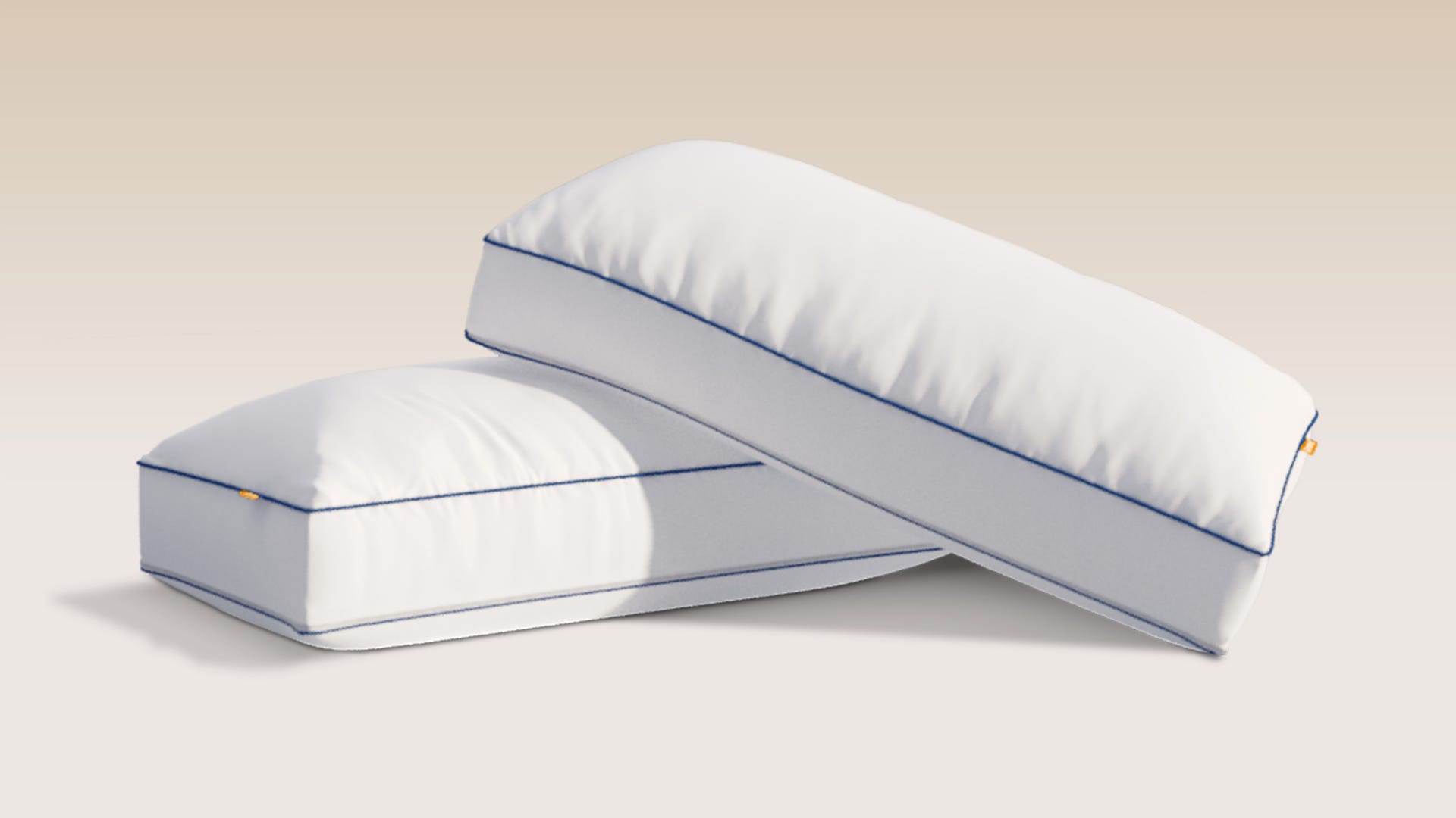 Two Comfort Cooling pillows on a grey background.