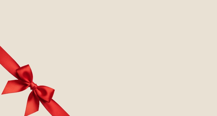 A mattress and Christmas bow in a clear background.