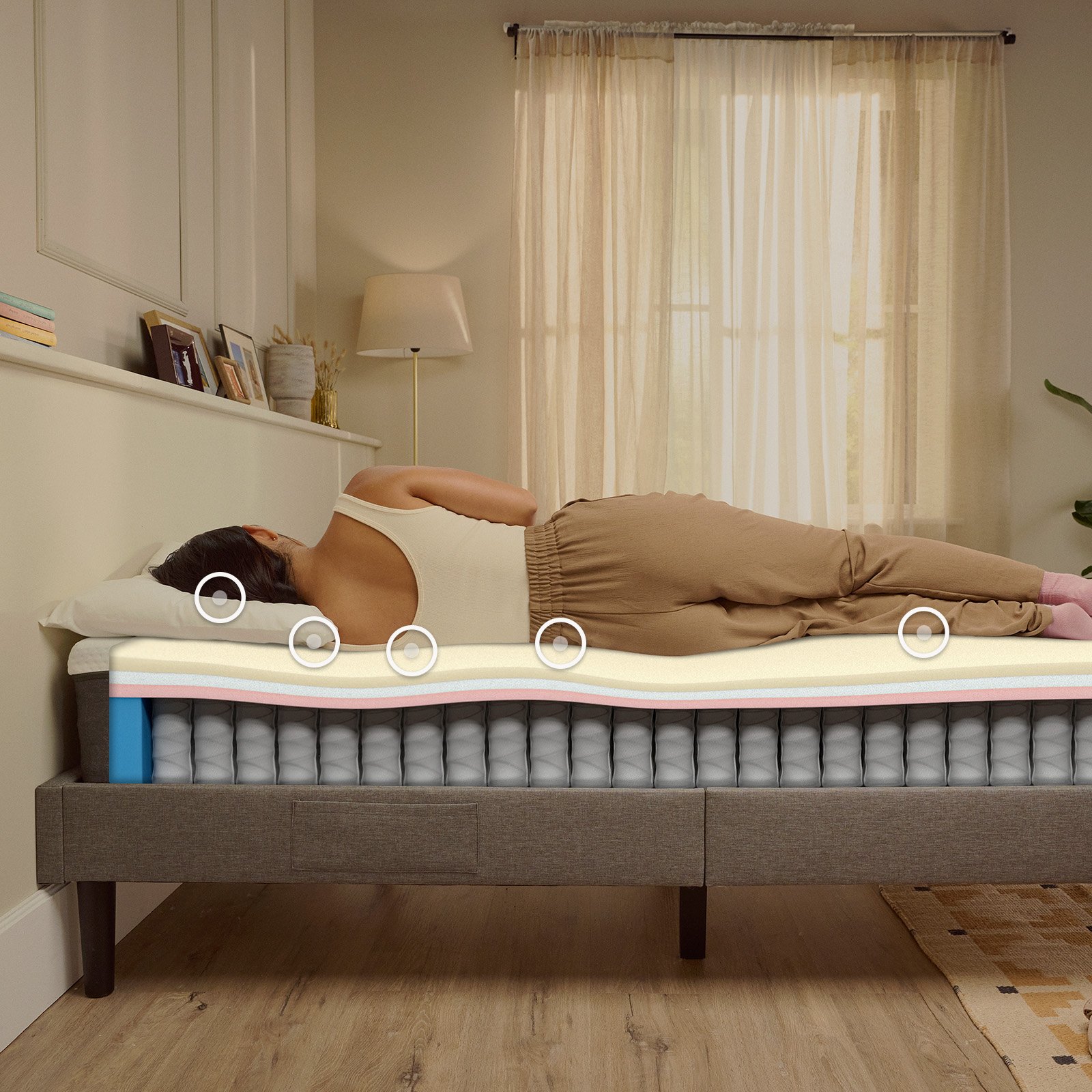 Woman sleeping on her side on an Emma Original mattress, with foam and spring layers visible beneath her.