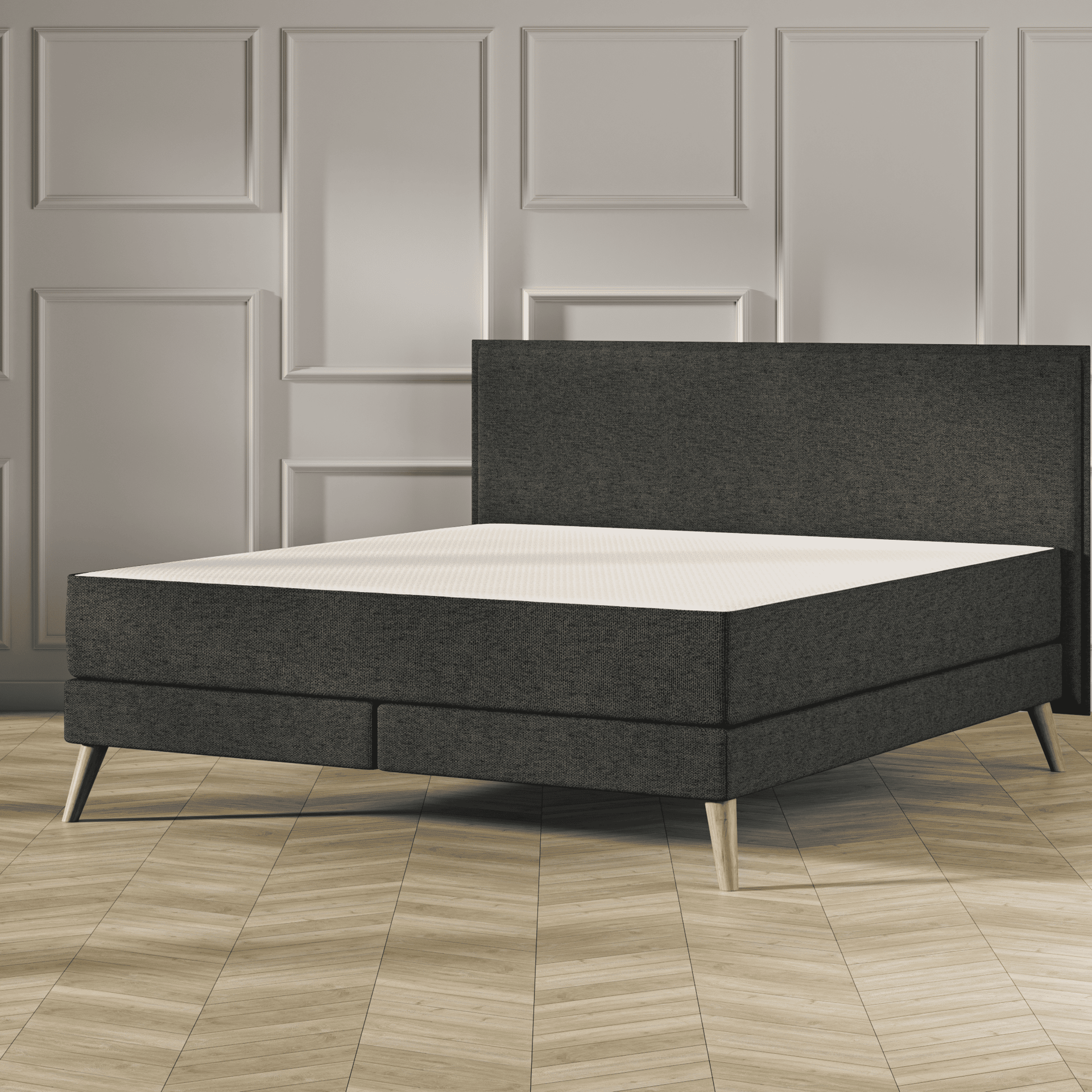 Emma Original Elite Boxspring bed in donkergrijs, met effen hoofdbord en houten pootjes, geplaatst in een stijlvolle slaapkamer met houten vloer.