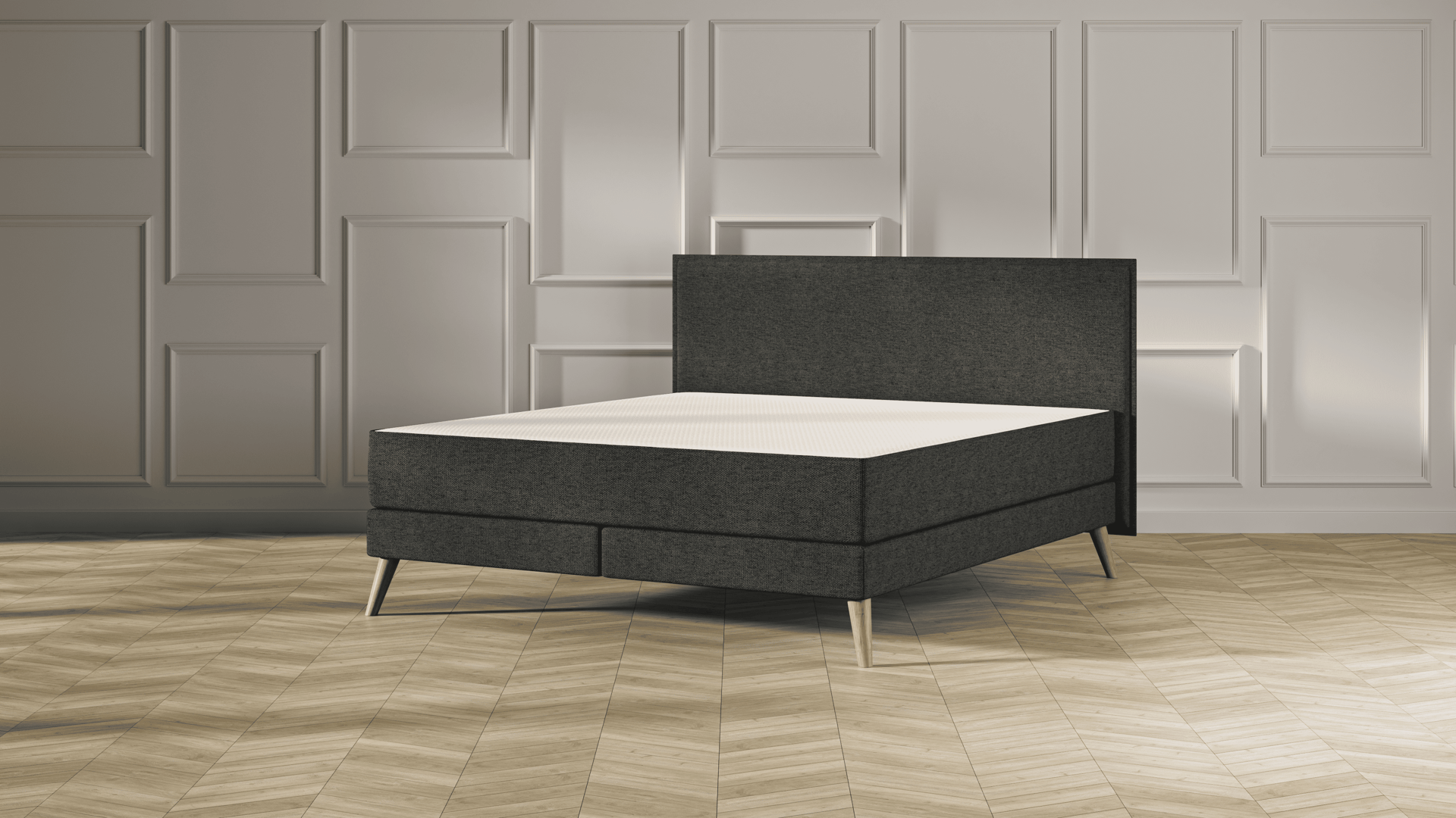 Emma Original Elite Boxspring bed in donkergrijs, met effen hoofdbord en houten pootjes, geplaatst in een stijlvolle slaapkamer met houten vloer.