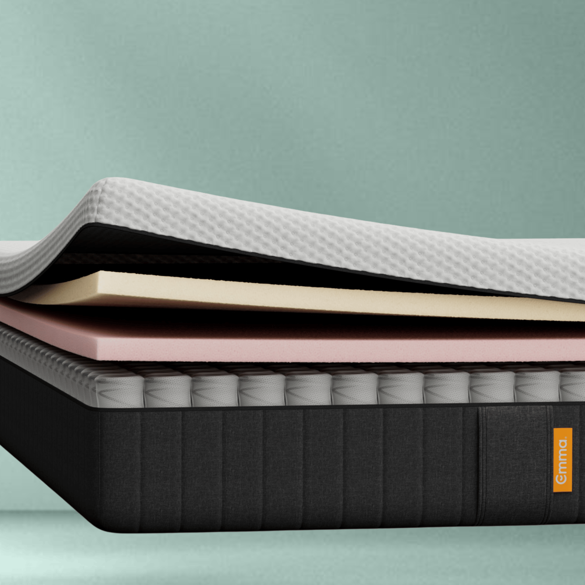 The Emma Original Lite Mattress side view on a green background.