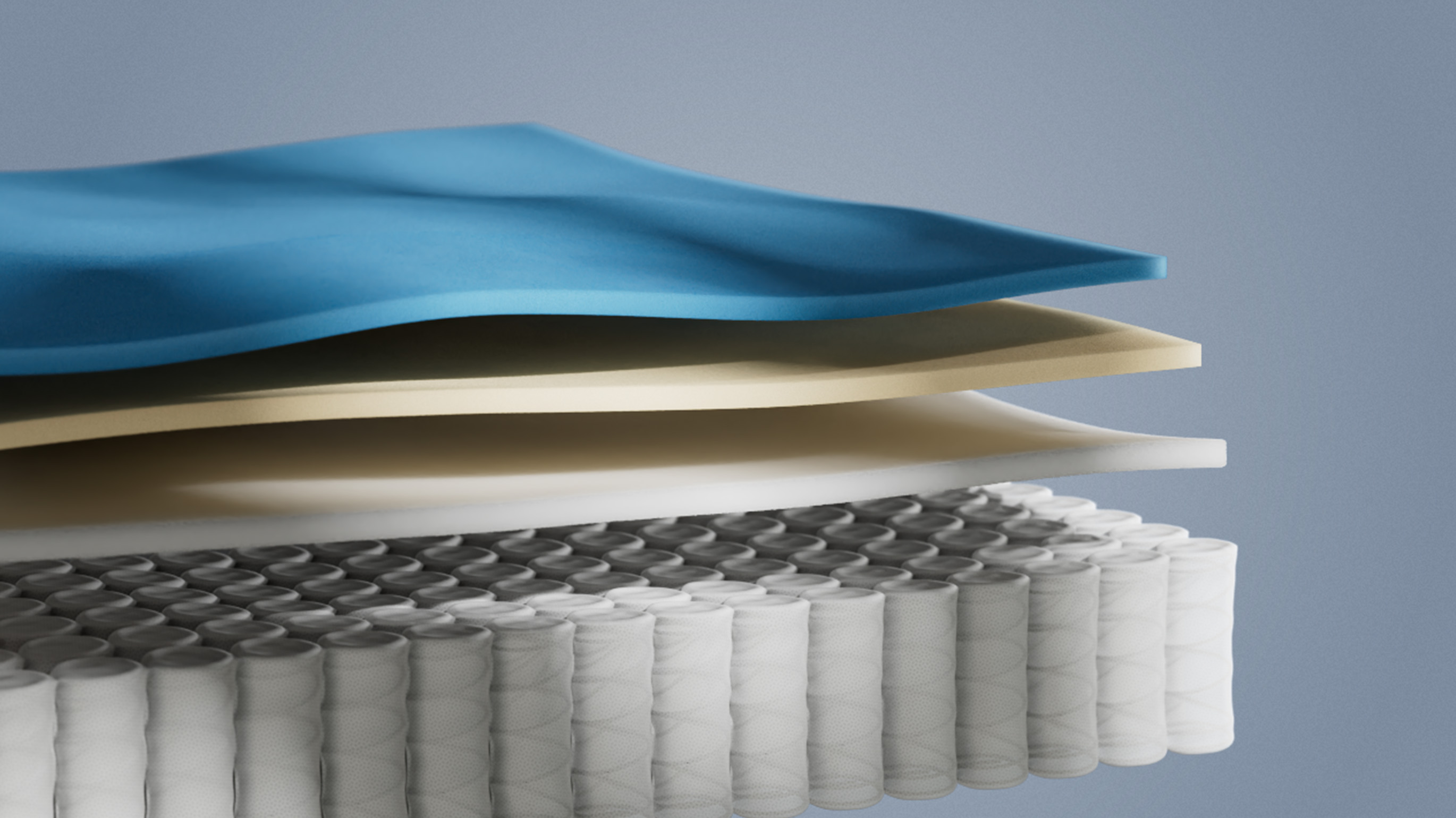 Vue en coupe d’un matelas hybride montrant plusieurs couches de mousse et une base de ressorts ensachés, illustrant le soutien, la respirabilité et le confort ergonomique du matelas.