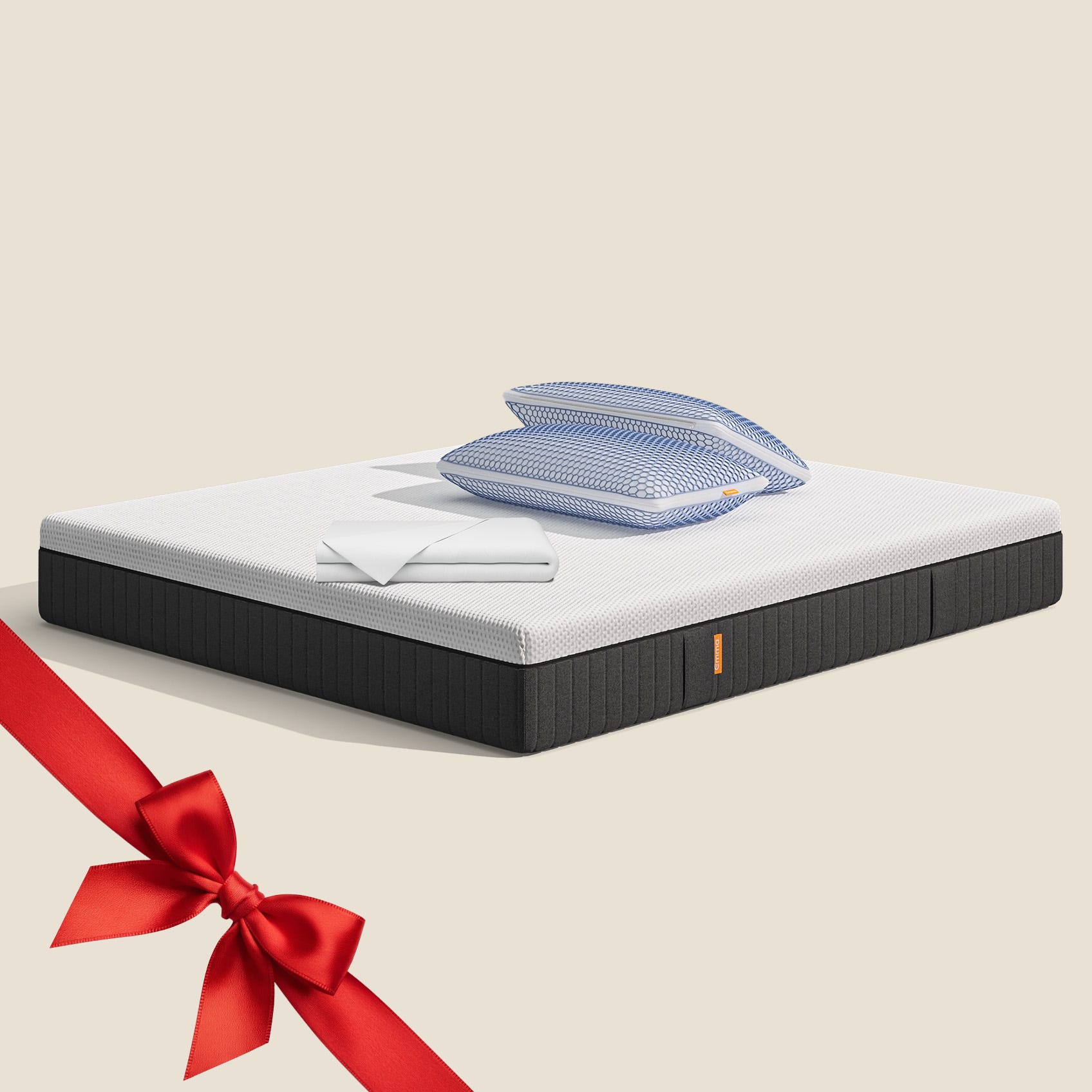 Uma imagem do pack Cooling Premium Plus, que inclui um colchão Emma Hybrid Premium+, almofadas Microfibra Zero Gravity, uma capa protetora, e roupa de cama branca