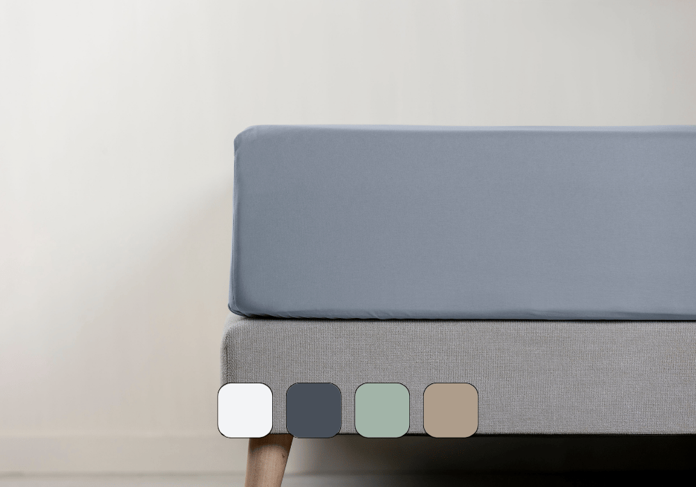 Vue latérale d’un matelas avec drap-housse.