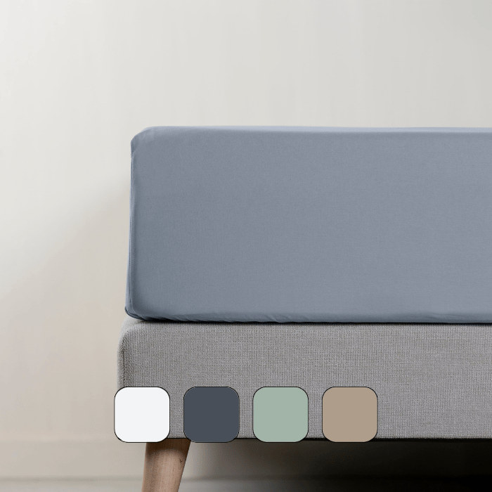 Vue latérale d’un matelas avec drap-housse.