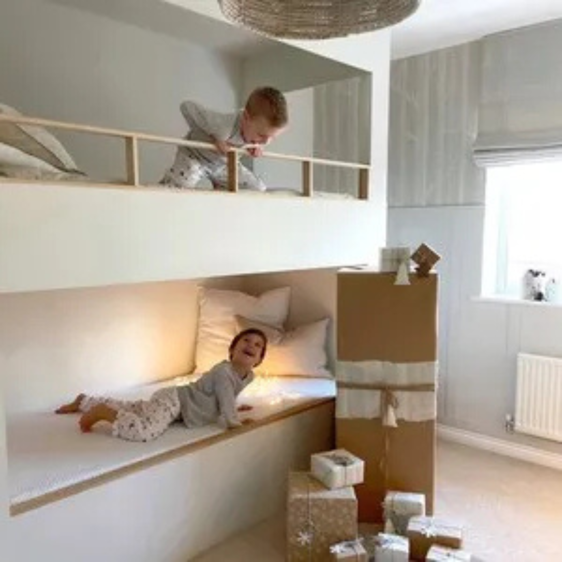 Children in a bunkbed playing on top of Emma mattresses.