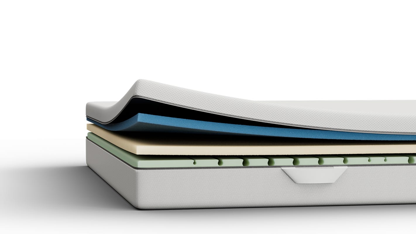 Aufgeschnittene Emma Elite Matratze mit sichtbaren Schichten.