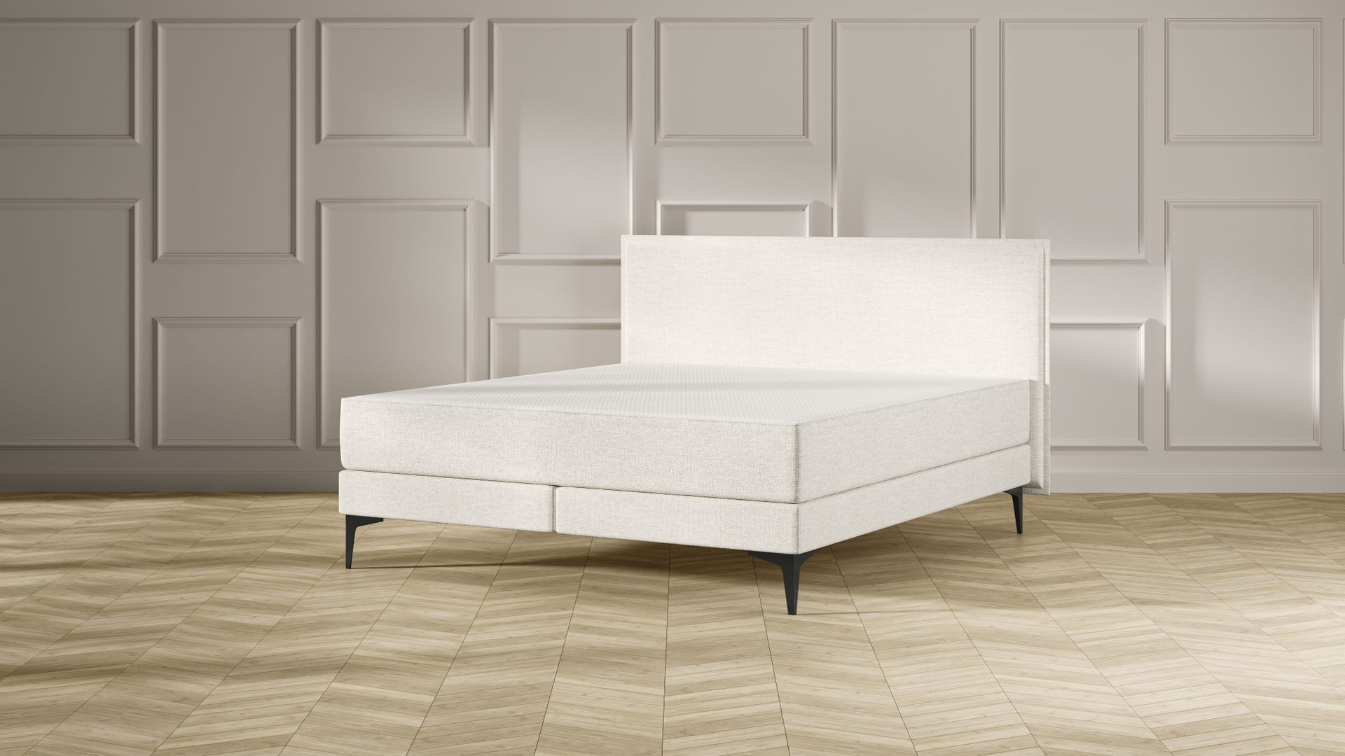 Emma Signature Boxspring bed in beige, met effen hoofdbord en metalen pootjes, geplaatst in een stijlvolle slaapkamer met houten vloer.