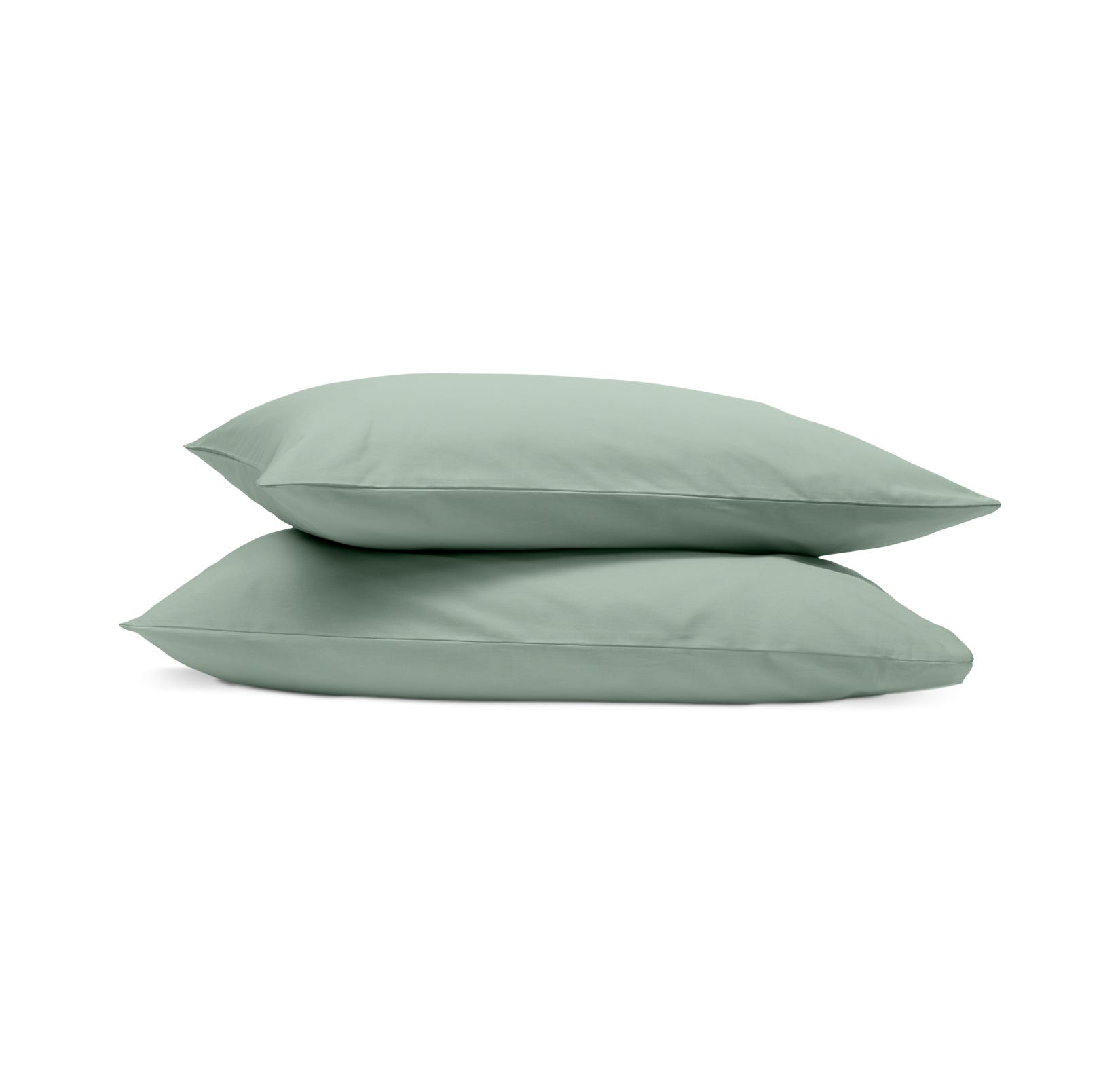 Due federe verde chiaro impilate su sfondo bianco