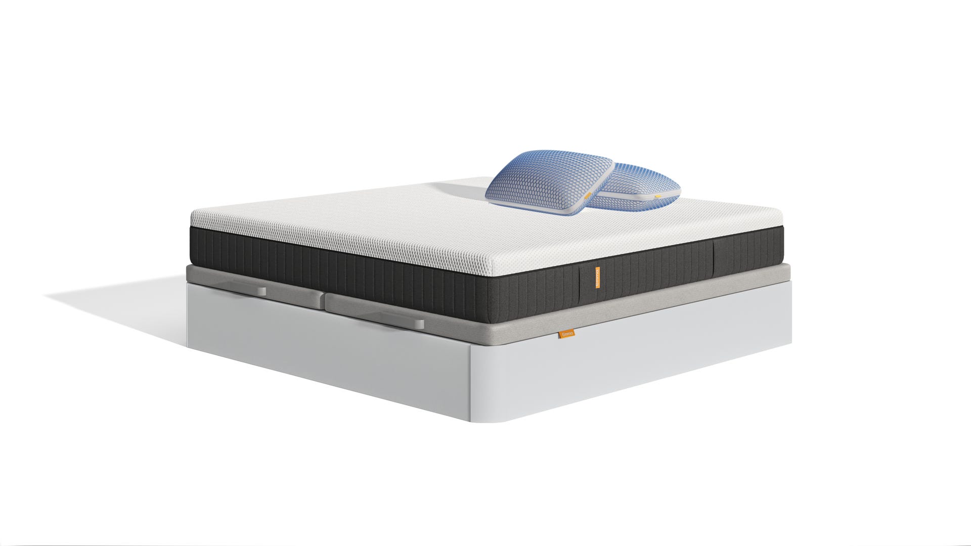 Uma imagem do pack Sommier Premium, que inclui uma cama sommier com arrumação branca, um colchão Emma Hybrid Premium+, e almofadas Microfibra Zero Gravity
