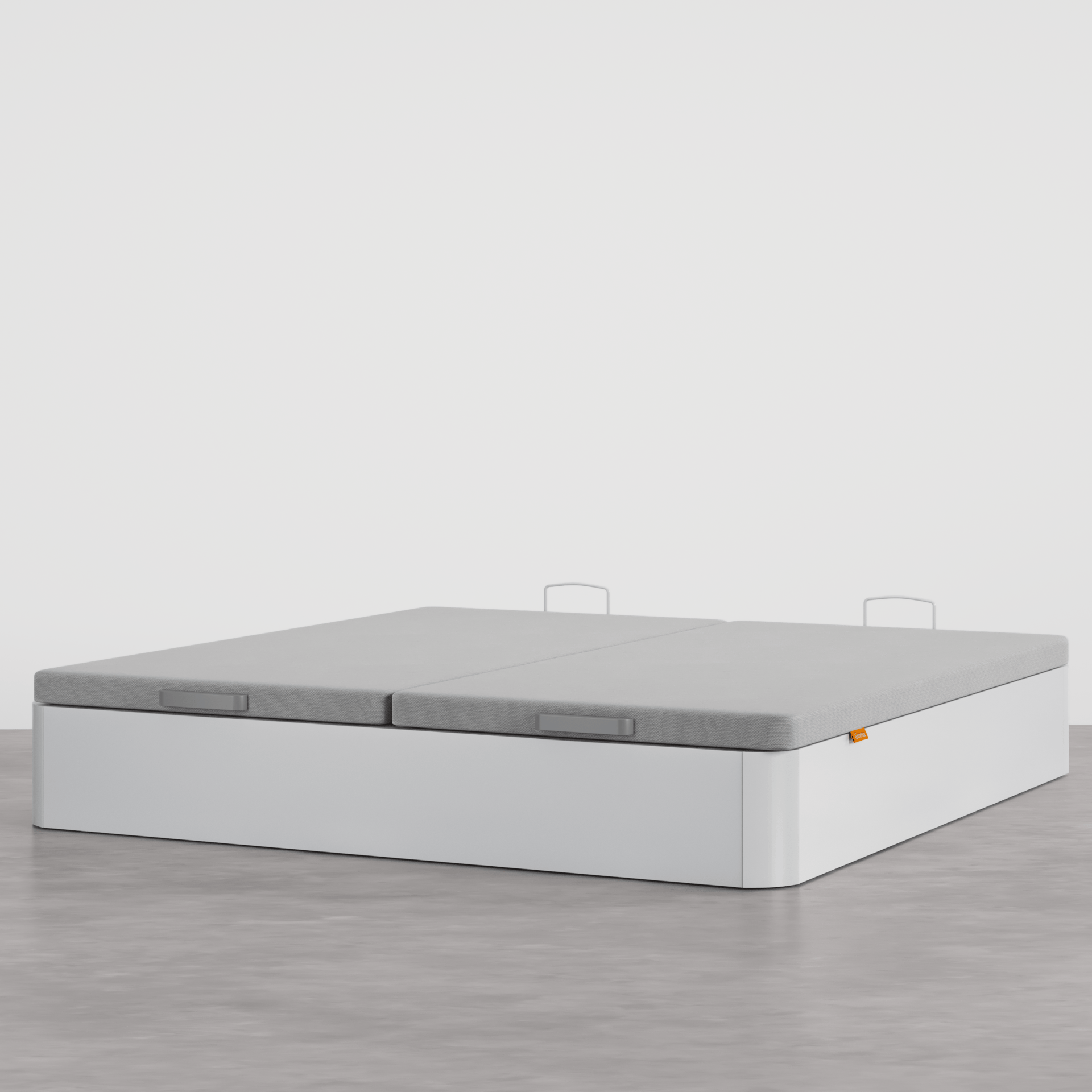 Canapé blanco en una habitación tipo estudio.