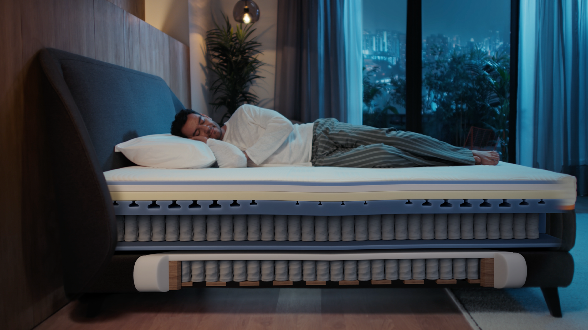 Cutaway of Emma Performance boxspringbed showing sleeper above pocket-spring mattress and spring base with layered support.