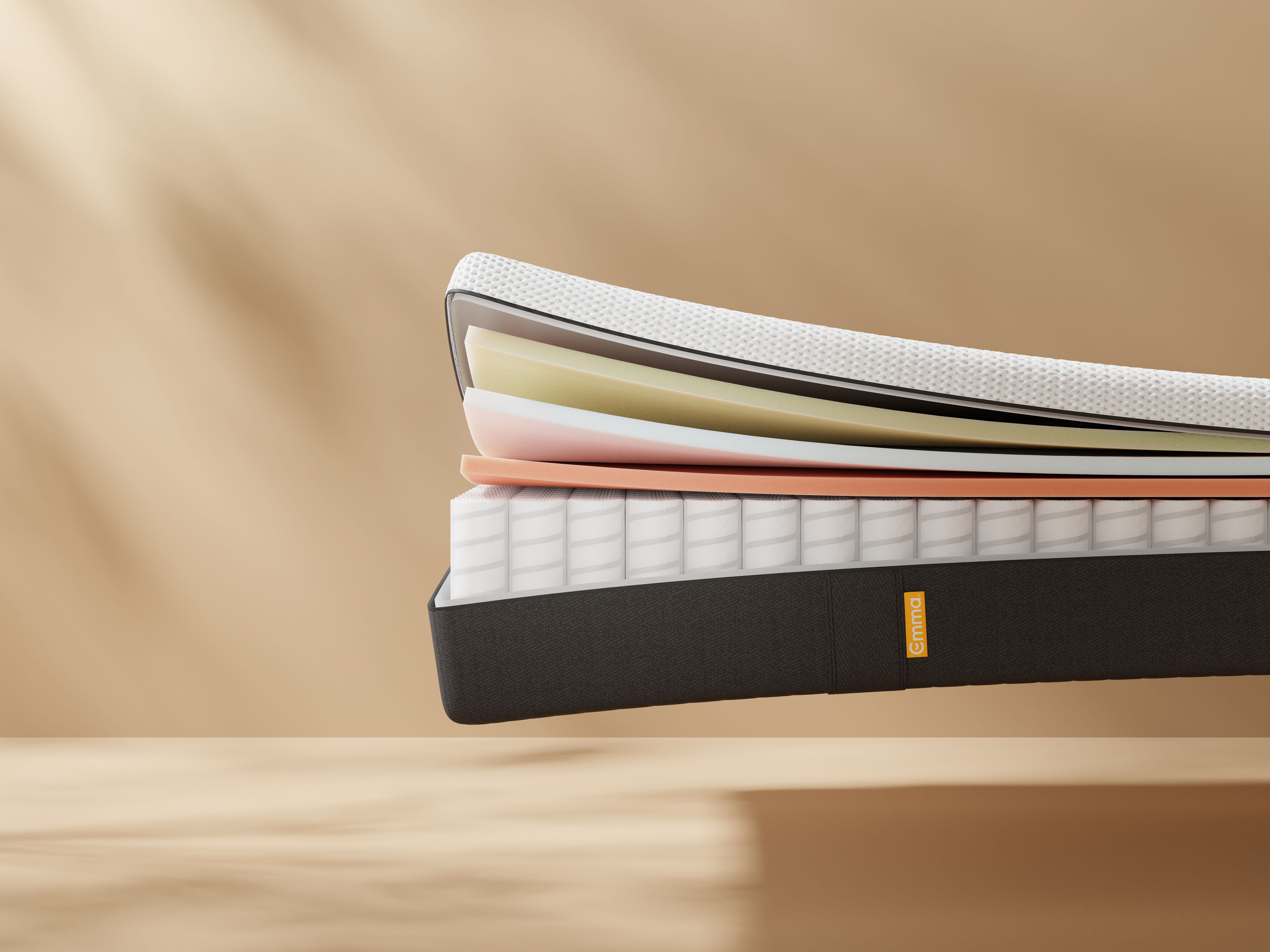 The Emma Hybrid Premium Mattress open on the side and showing 5 layers expanded.