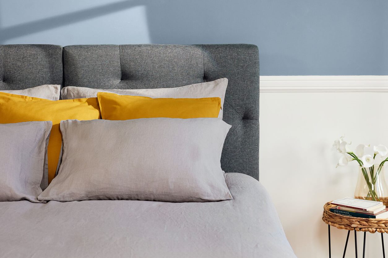 Signature Bed Yellow pillow and headboard