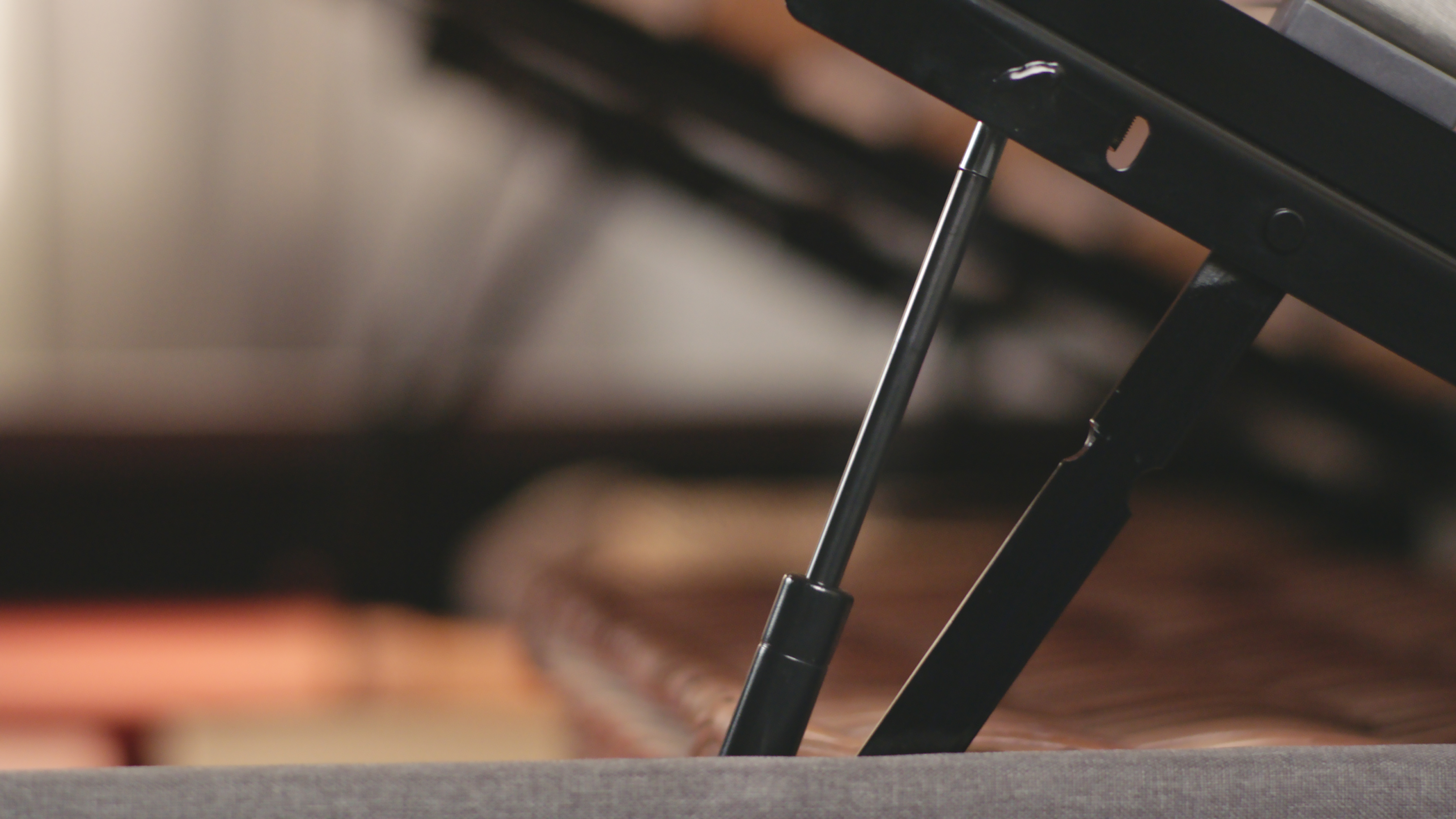 The opening mechanism of the Emma Ottoman Storage bed.