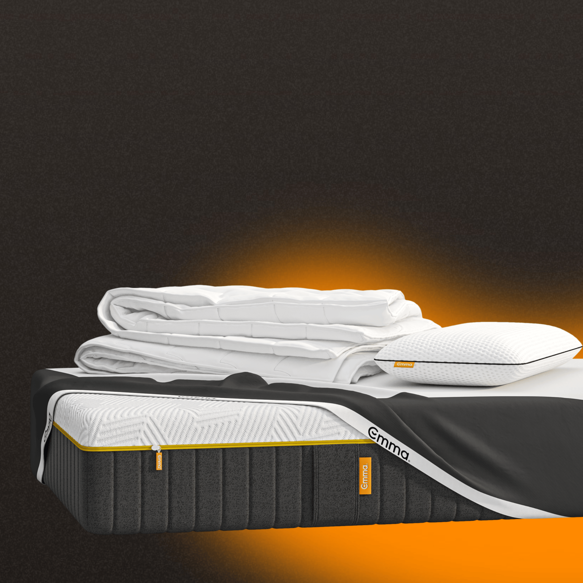 A mattress with a mattress protector, pillows and duvet on a dark background.