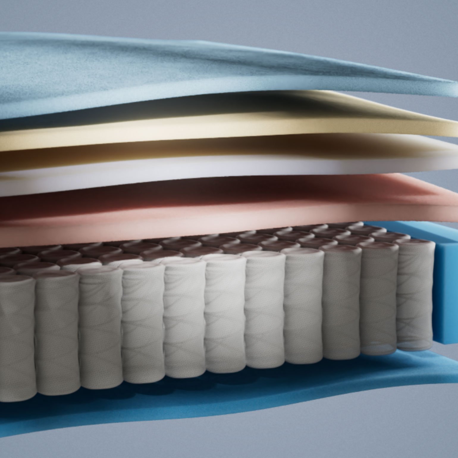 Emma Original Pro mattress layers view showing blue and cream foam layers above a pocket spring core in close-up detail.