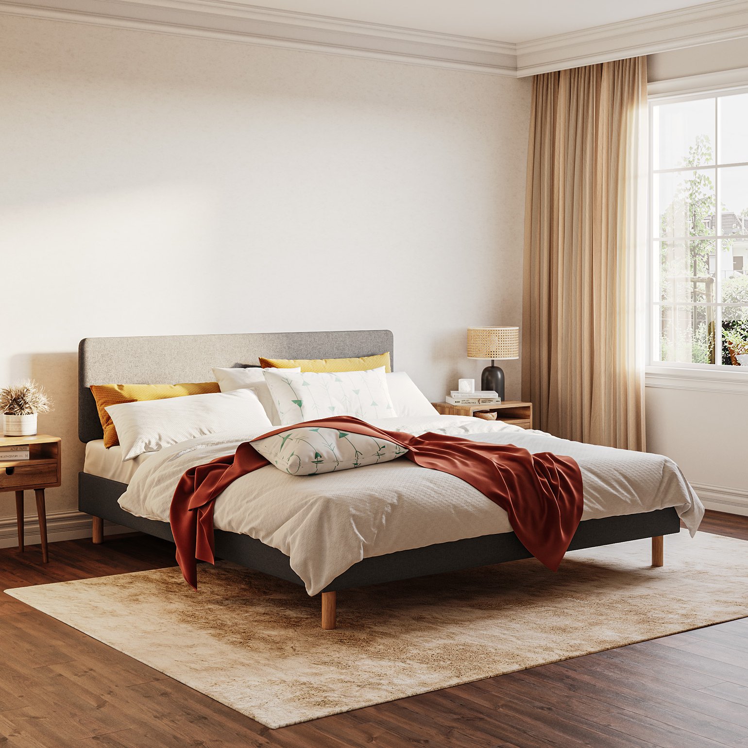 Emma Box Bed gris avec tête de lit rembourrée et pieds en bois, dans une chambre chaleureuse avec une grande fenêtre.