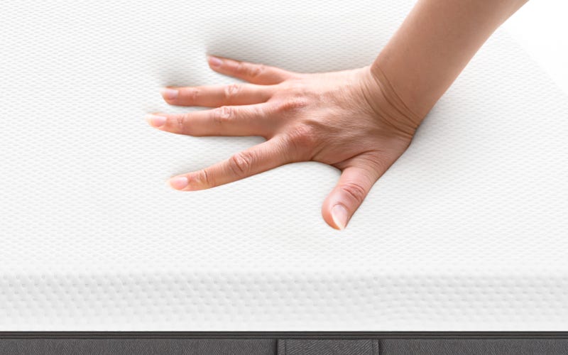 Small-emma-original-mattress-cover-with-hand.png