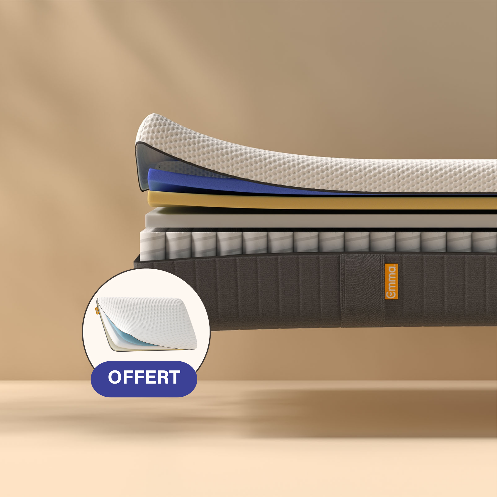 Coupe transversale d'un matelas montrant plusieurs couches, dont une couche supérieure texturée blanche, des couches intermédiaires bleues et jaunes, et un sommier dont les ressorts sont visibles. Le matelas porte l'inscription "Emma" sur le côté.