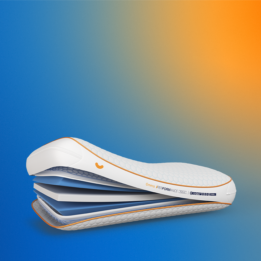 Emma Performance Adapt Pillow render showing internal layers including AirGrid and foam on a blue-orange gradient background.