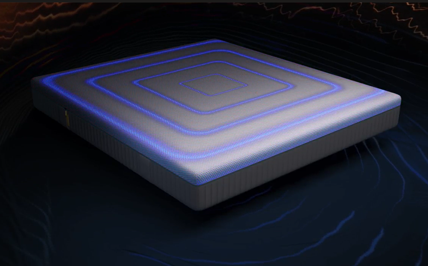 Una mano desliza suavemente sobre el colchón con tecnología AirGrid.