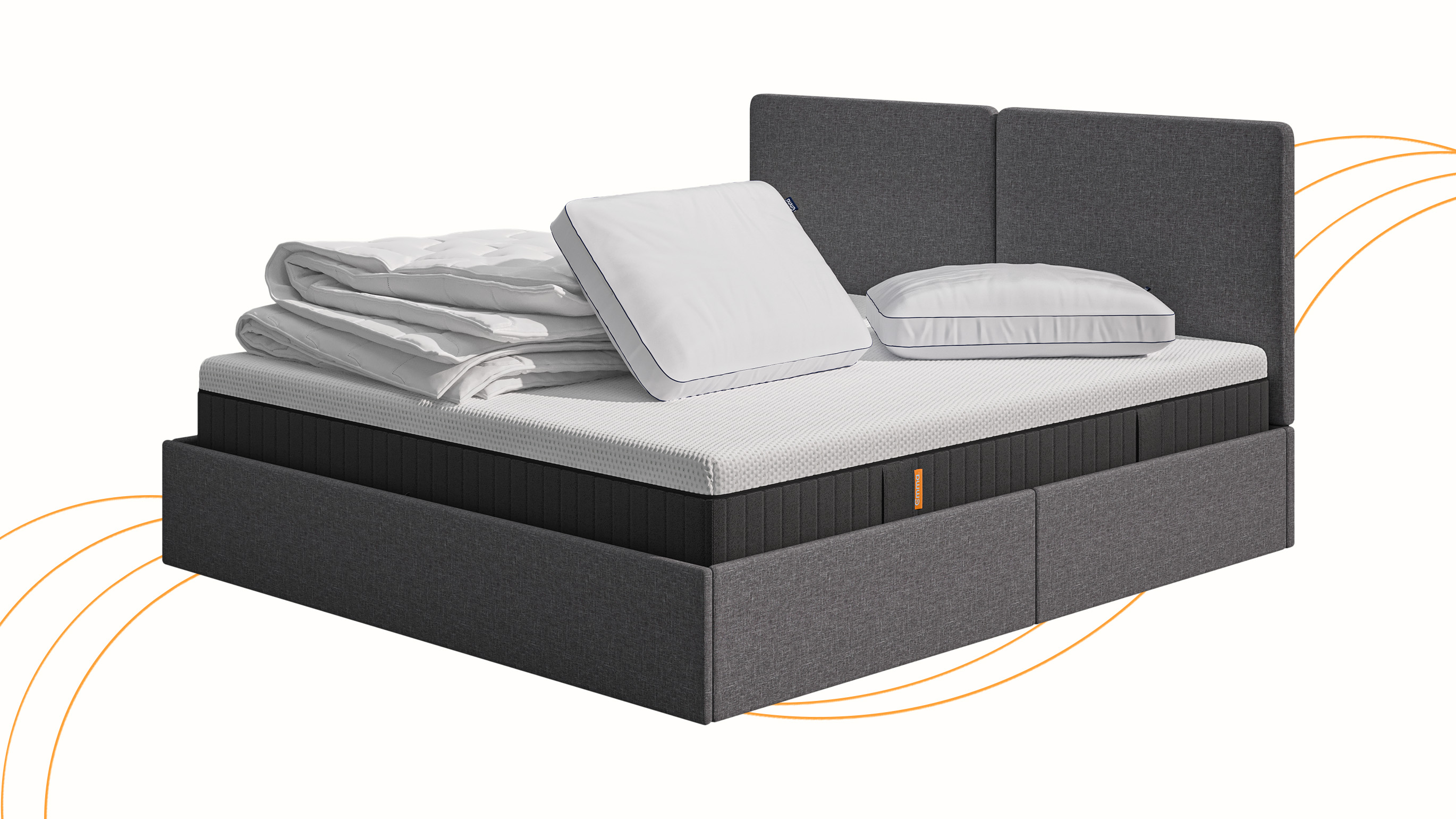 An Emma ottoman storage in a well lit bedroom. The bed has pillows and a duvet on top.