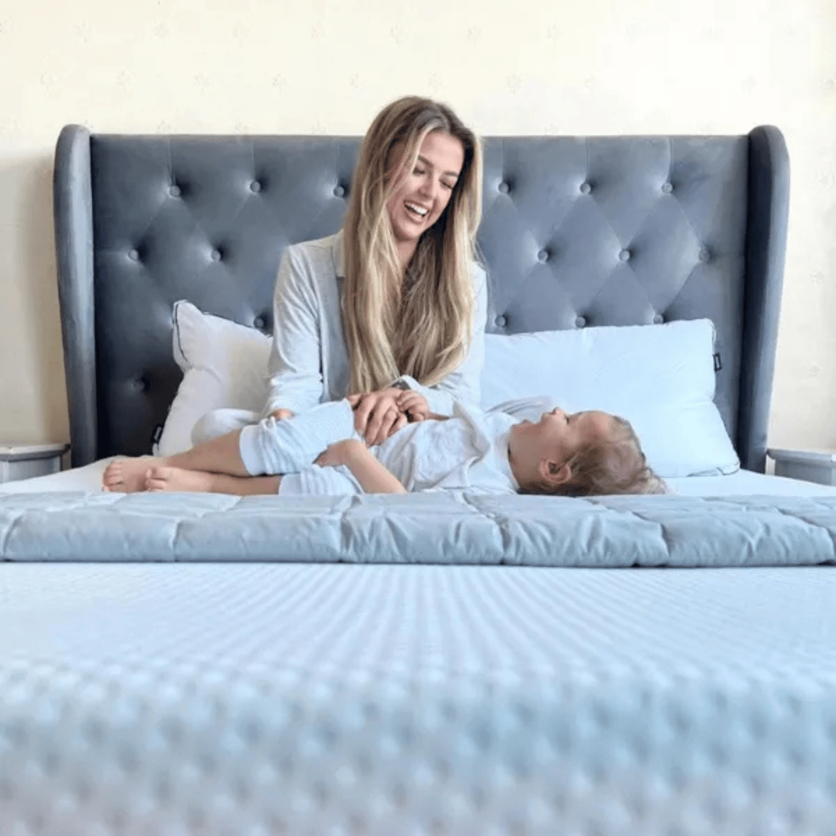 Girl and child laying on an Emma Mattress.