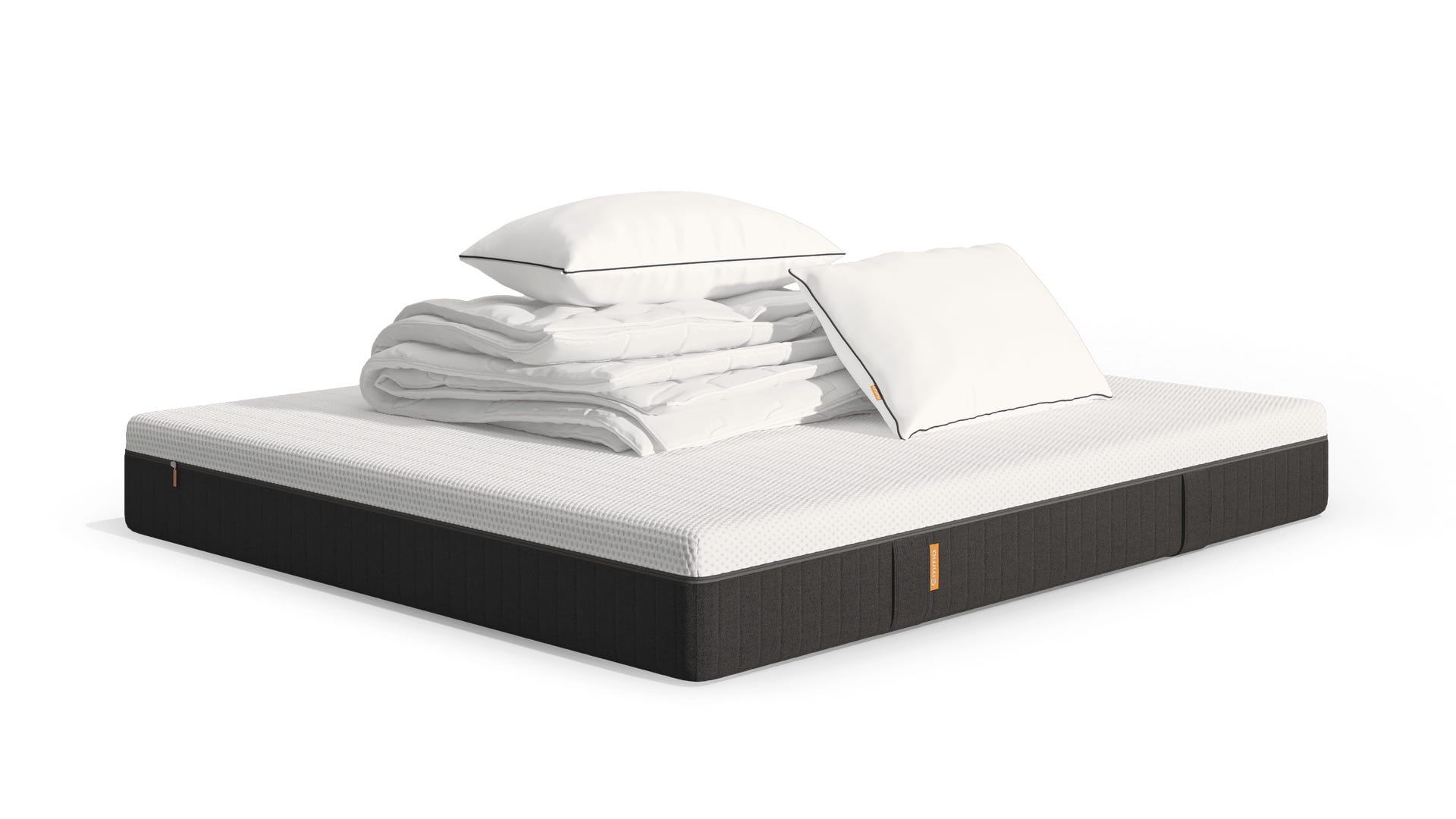 Emma Hybrid Premium matras met witte bovenlaag en donkere basis, bovenop twee witte Wolkenkussens met zwarte biezen en een opgevouwen dekbed; de opstelling benadrukt frisheid en comfort.