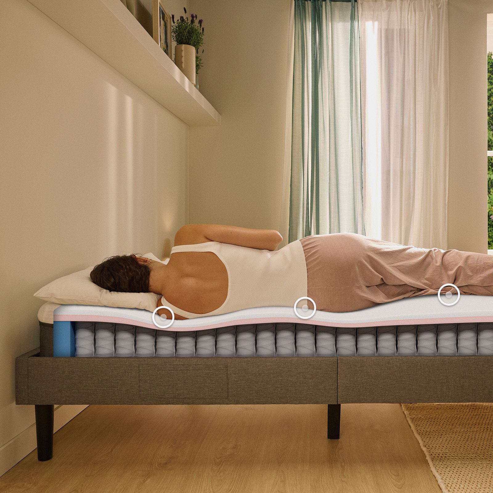 Person lying on their side on a white mattress in a relaxed sleeping position.