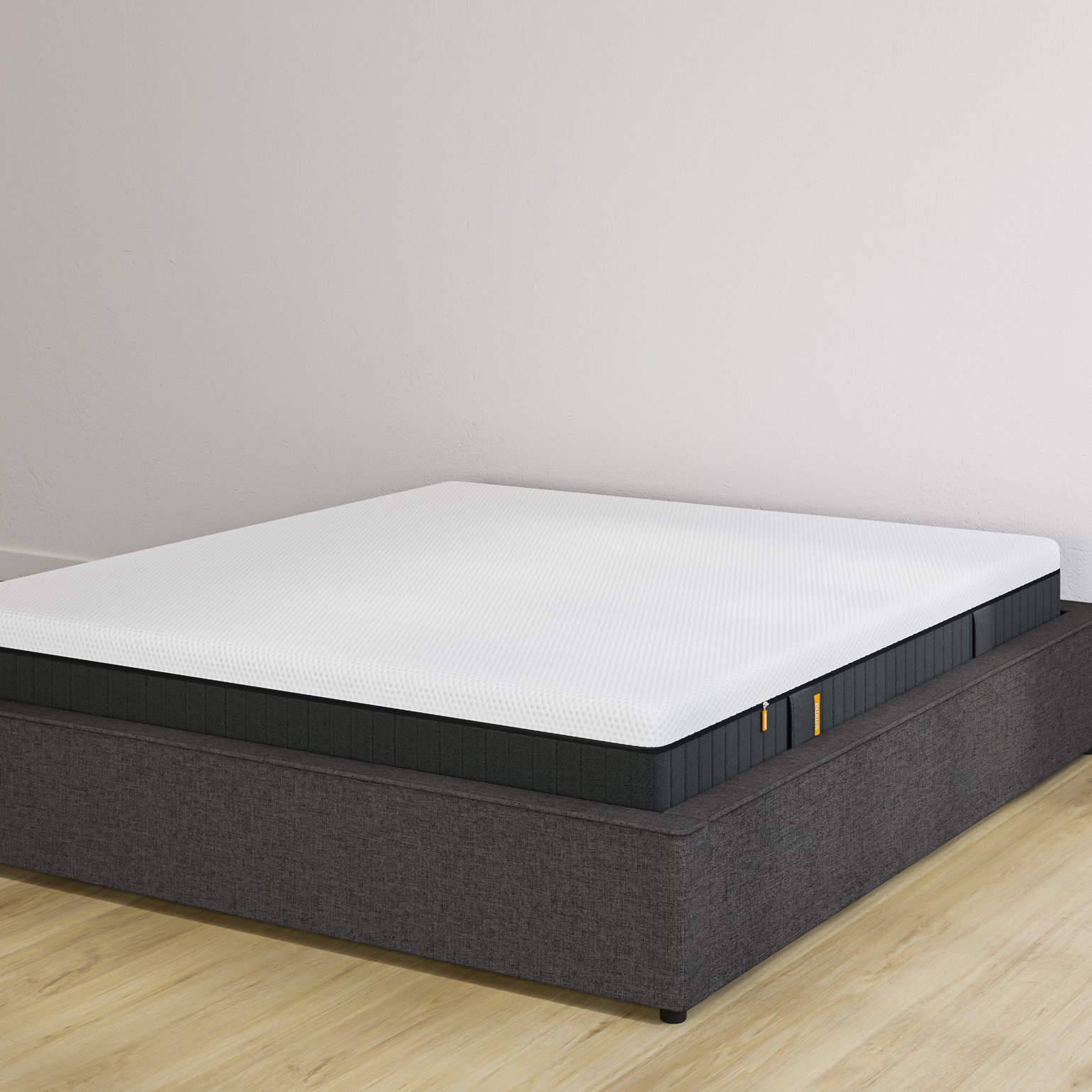 Emma storage bed base in charcoal upholstery without headboard, with Original Elite mattress on top.
