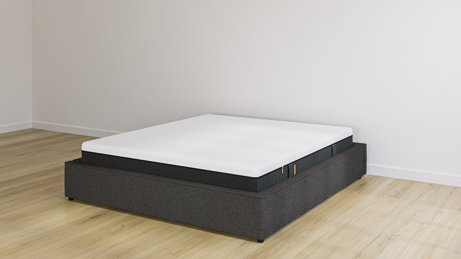 Emma storage bed base in charcoal upholstery without headboard, with Original Elite mattress on top.