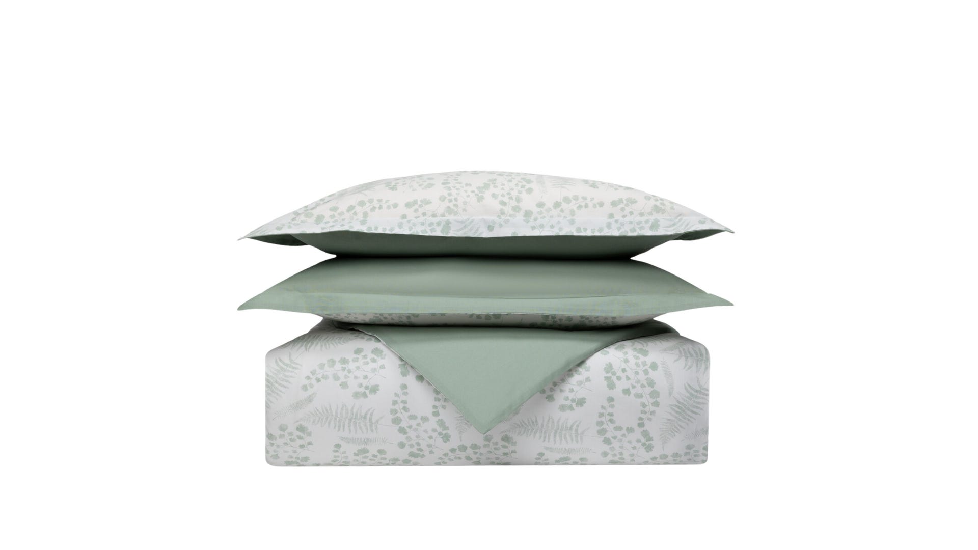 Set di biancheria impilato con cuscini e piumone a motivo foglia verde su sfondo bianco