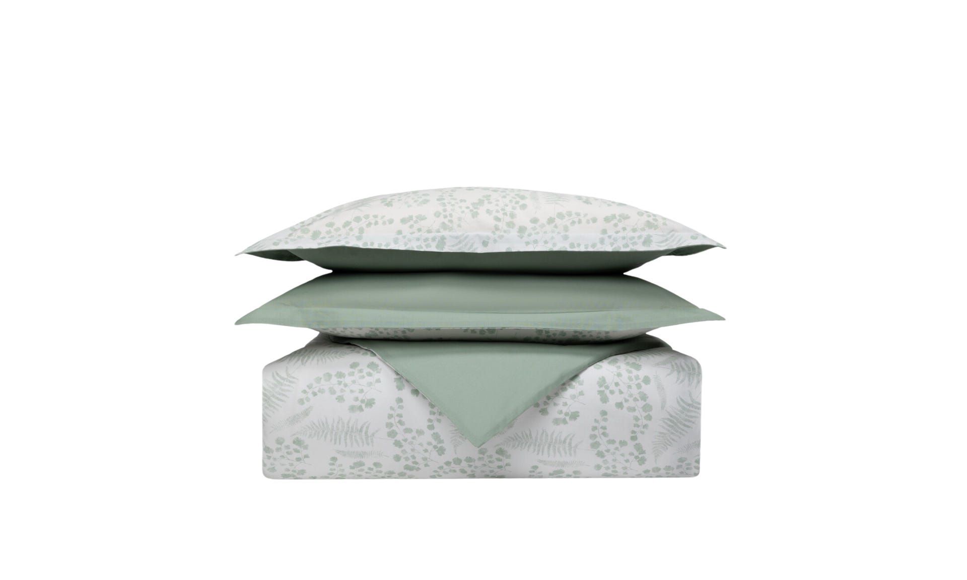 Set di biancheria impilato con cuscini e piumone a motivo foglia verde su sfondo bianco