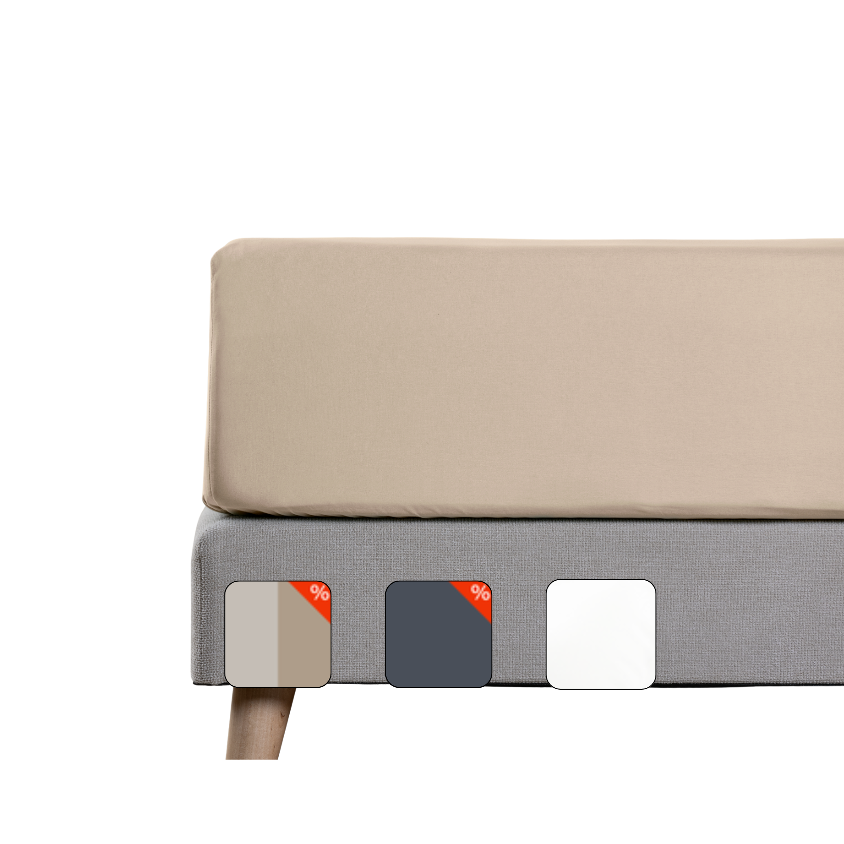 Uma imagem de um lençol de baixo em percal, em bege, sob um colchão com fundo cinzento