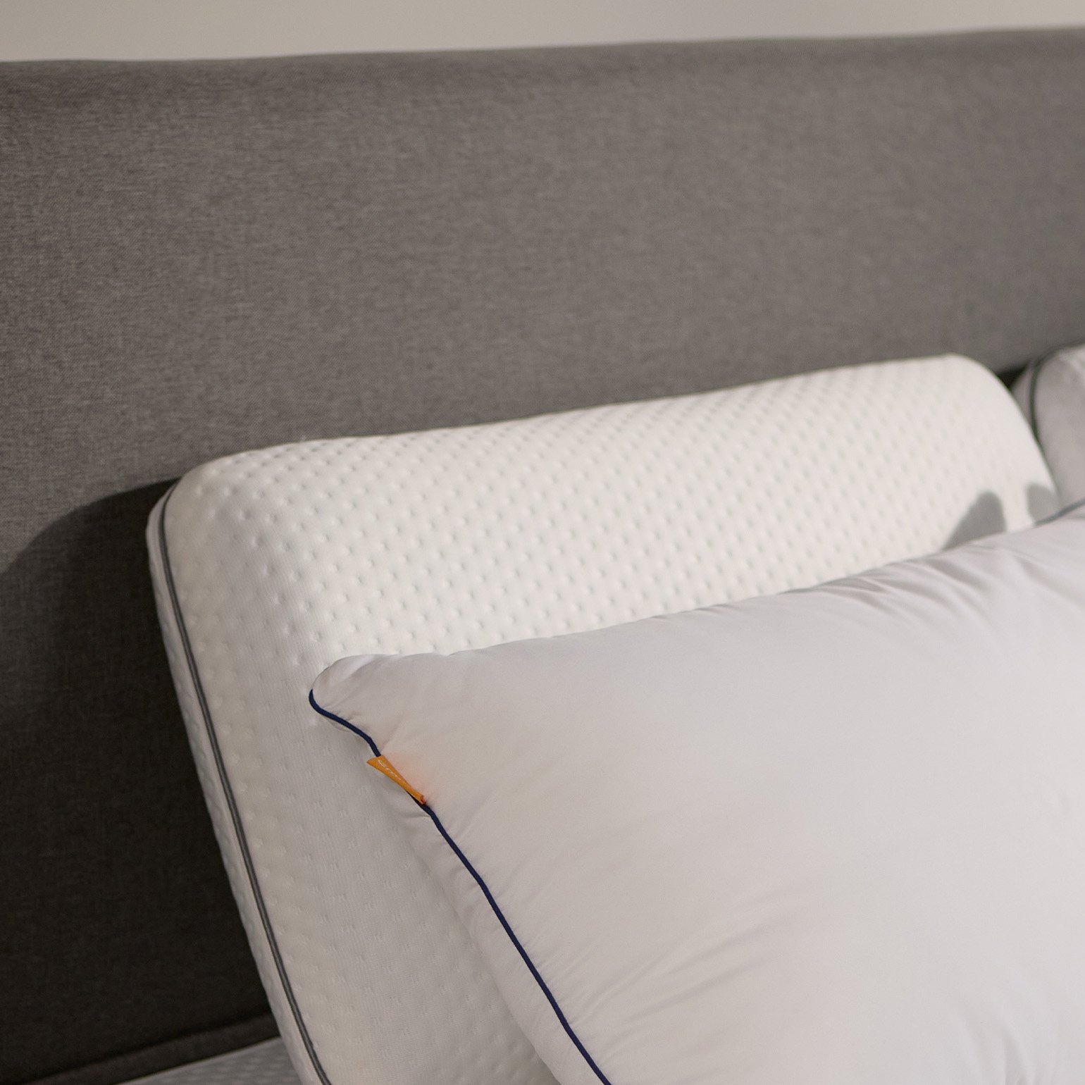 Close-up of the Emma Boxspring Bed in dark grey showing the upholstered headboard corner with an Emma pillow.You said: cannot see this chat