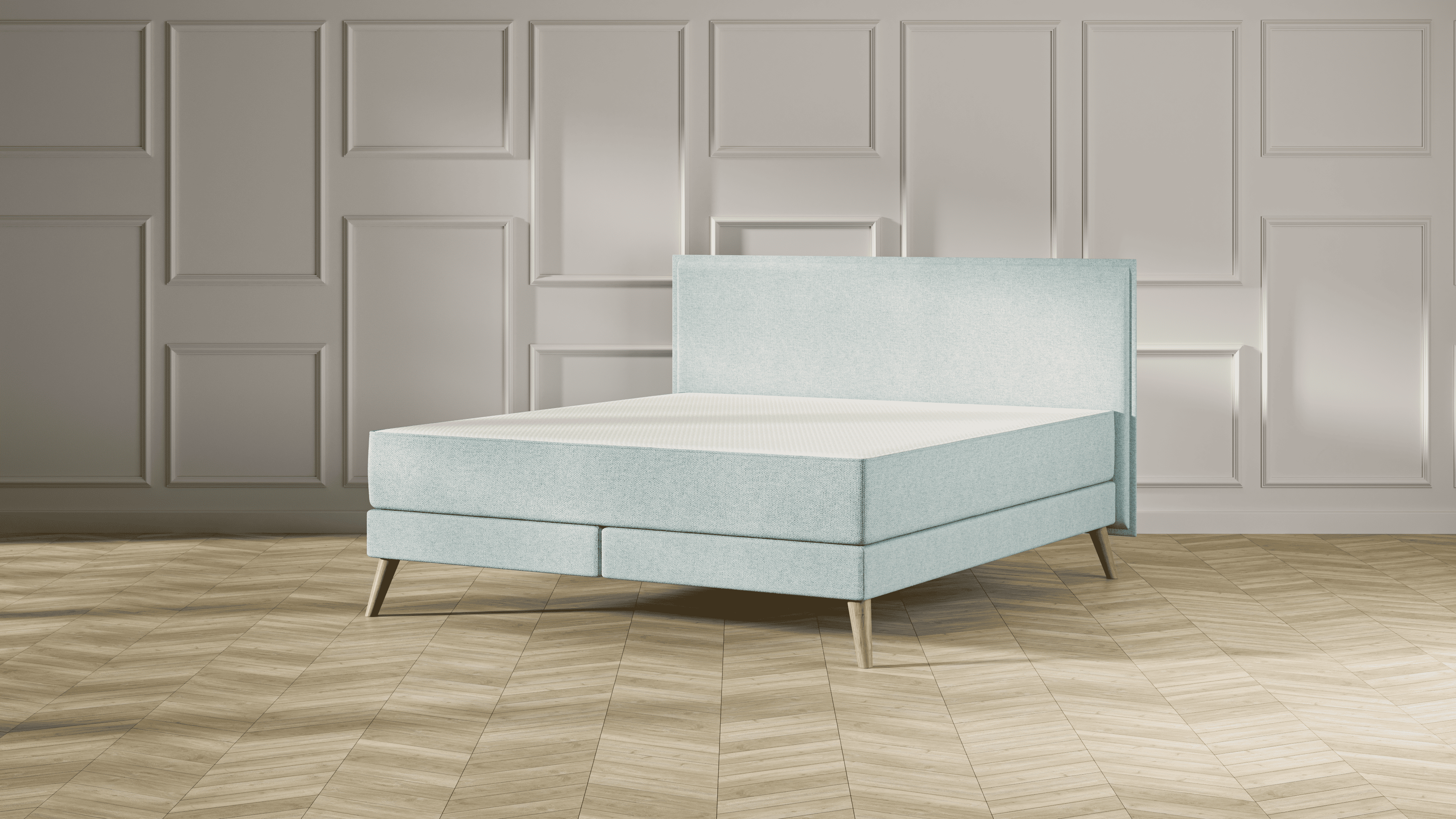 Emma Signature Boxspring bed in mint groen, met effen hoofdbord en houten pootjes, geplaatst in een stijlvolle slaapkamer met houten vloer.