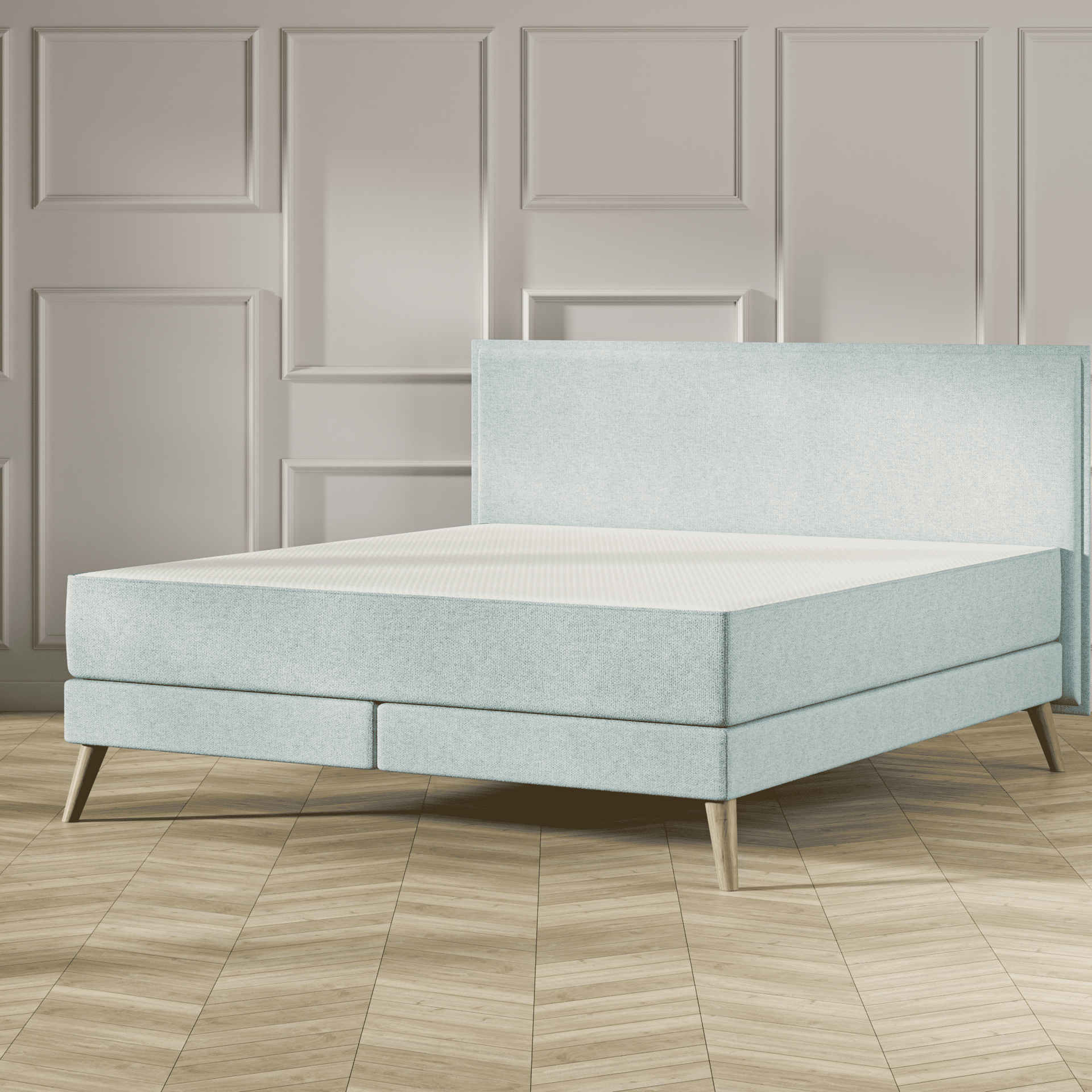 Emma Original Elite Boxspring bed in mint groen, met effen hoofdbord en houten pootjes, geplaatst in een stijlvolle slaapkamer met houten vloer.