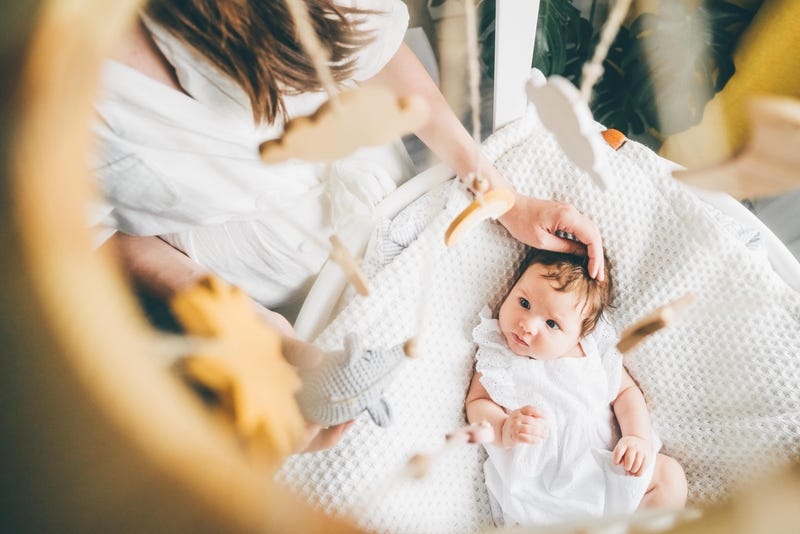 beautiful-young-mother-with-a-baby-girl-at-home-2021-08-28-15-08-40-utc-min.jpg