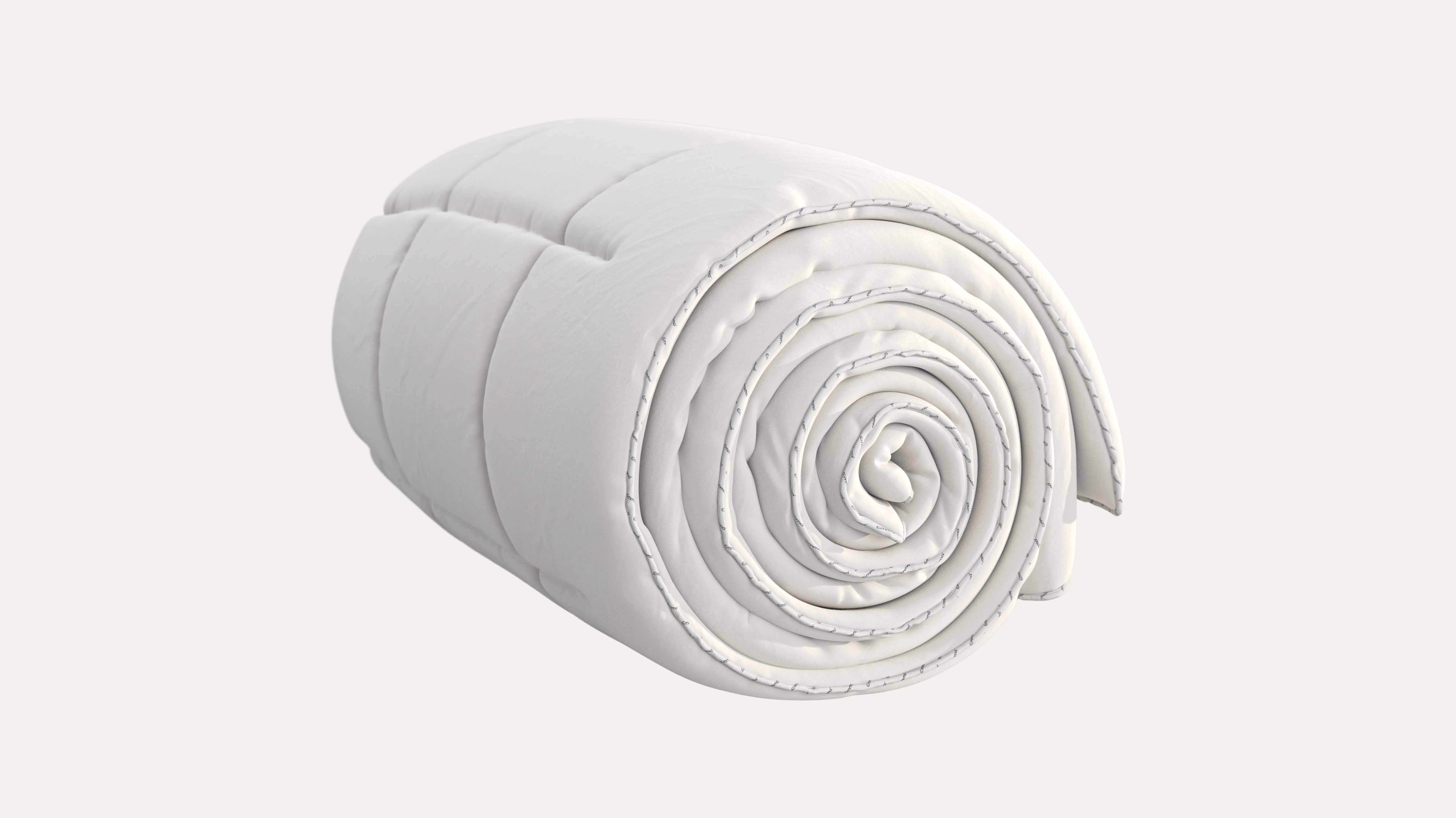 Piumone bianco arrotolato con cuciture orizzontali visibili.