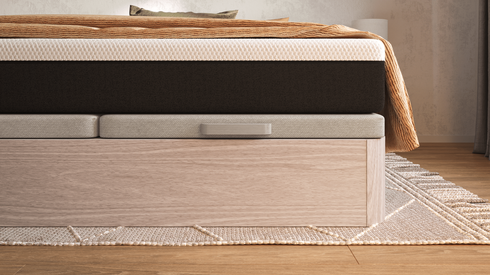 Imagem de perto de um sommier com arrumação Emma, com um acabamento castanho, com um colchão Emma em cima