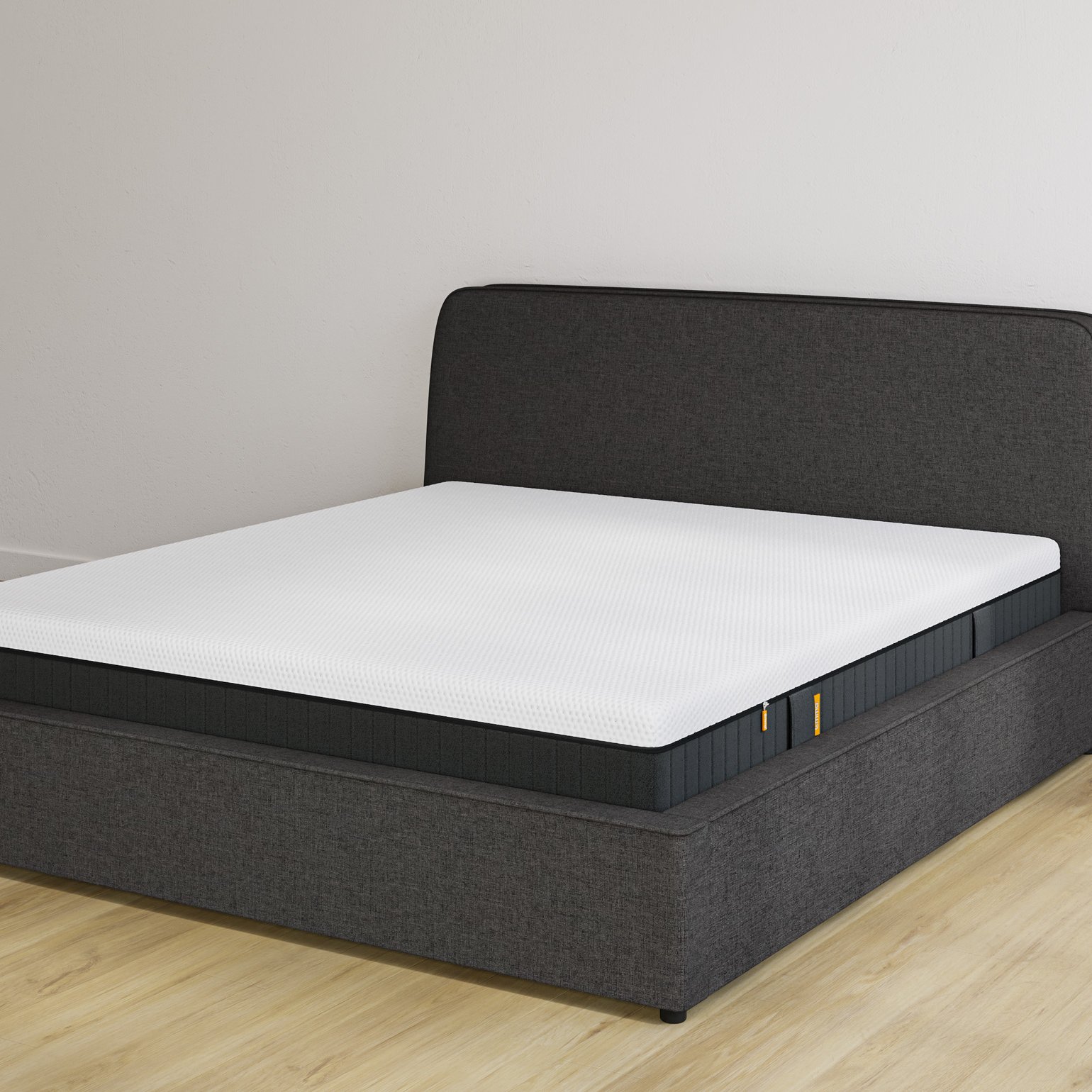 Emma storage bed in charcoal upholstery with headboard and Original Elite mattress, on light wood floor.