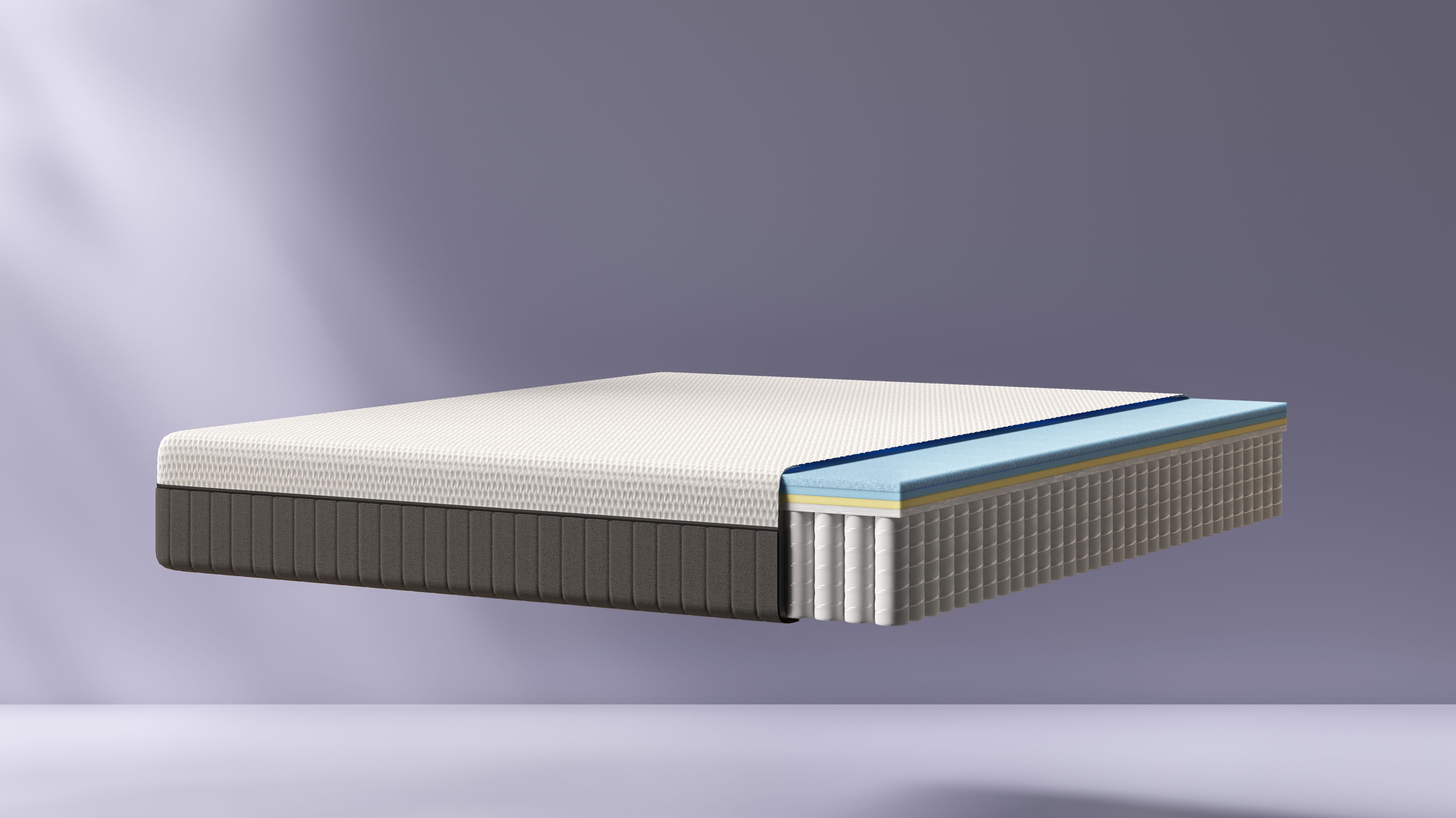 Coupe latérale du matelas Emma Hybride Premium II montrant mousses et ressorts