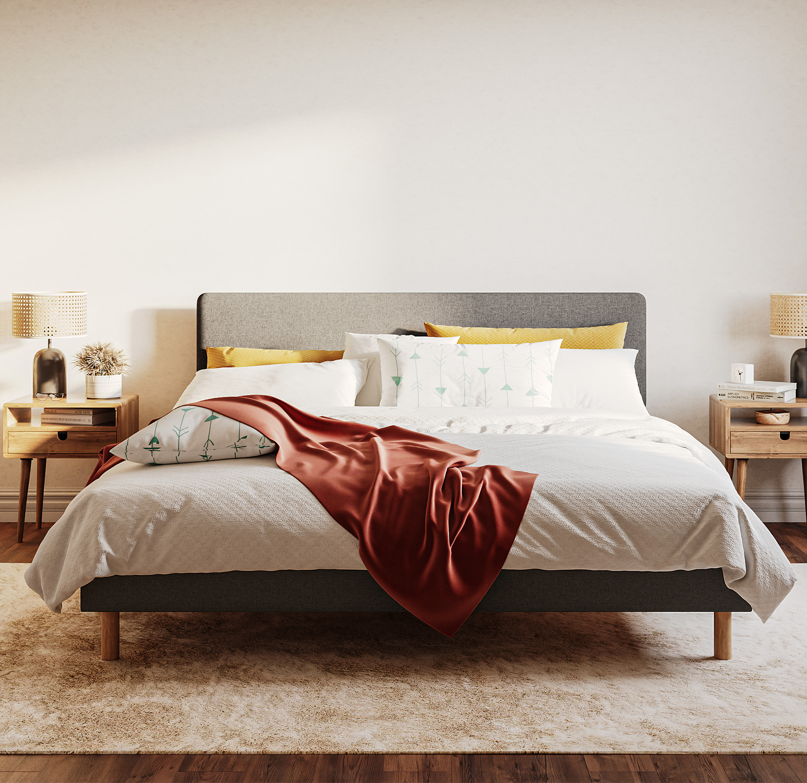 Emma Boxbed in grey with upholstered headboard and wooden legs, styled in a warm Scandinavian bedroom.