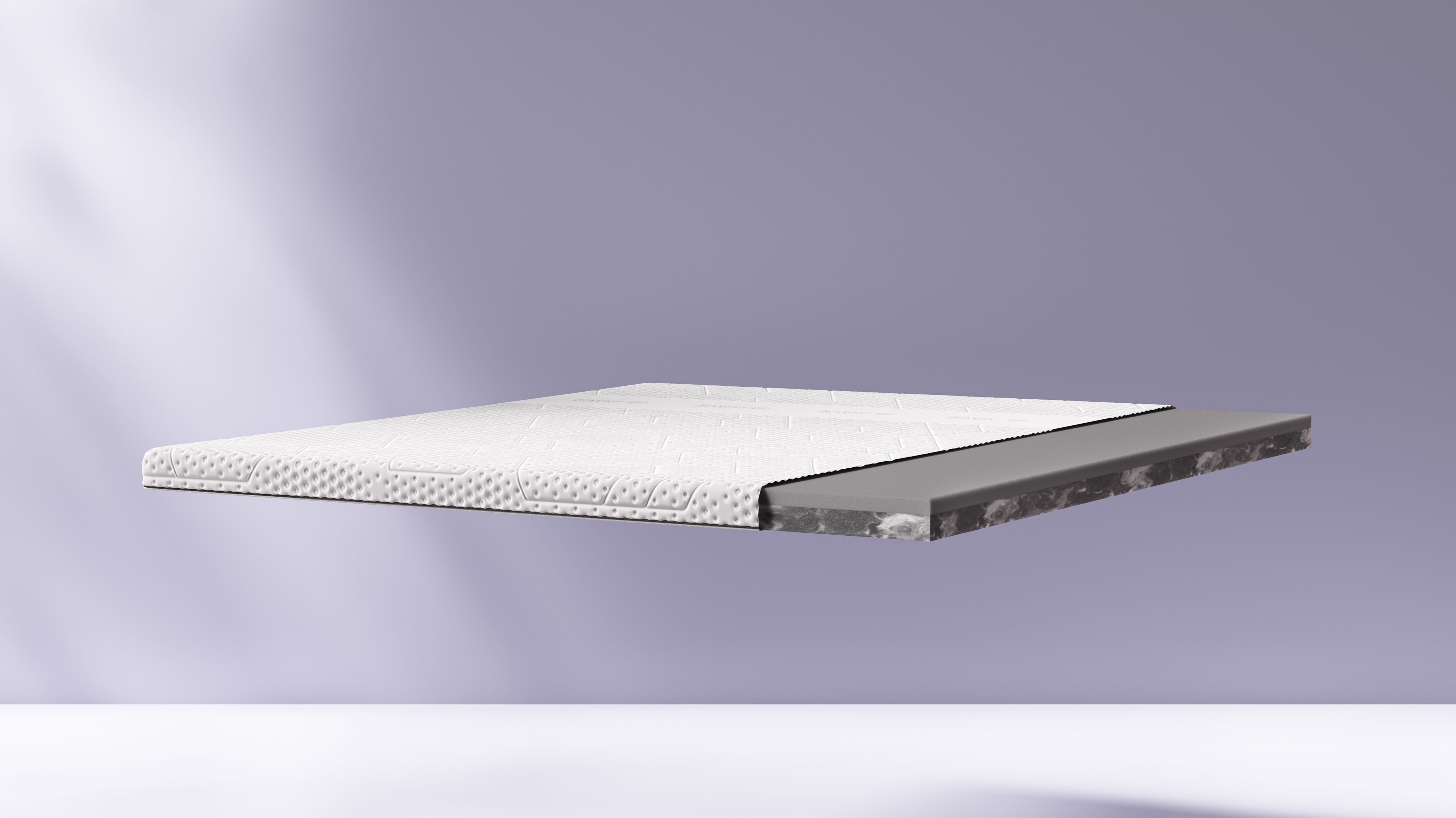 Emma Premium Mattress Topper cut on the side with the layers visible.