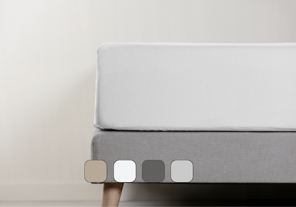 Vue latérale d’un matelas avec drap-housse.