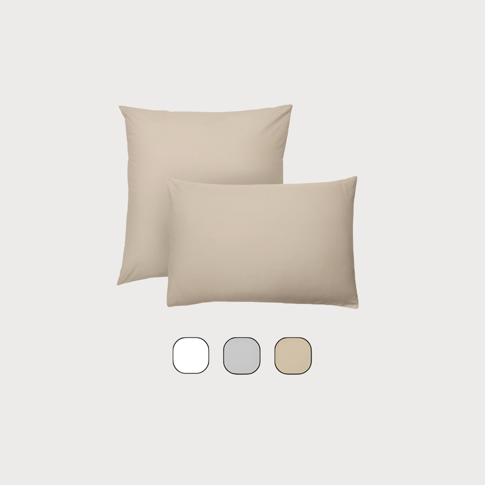 Deux oreillers avec leurs taies et échantillon de couleurs.