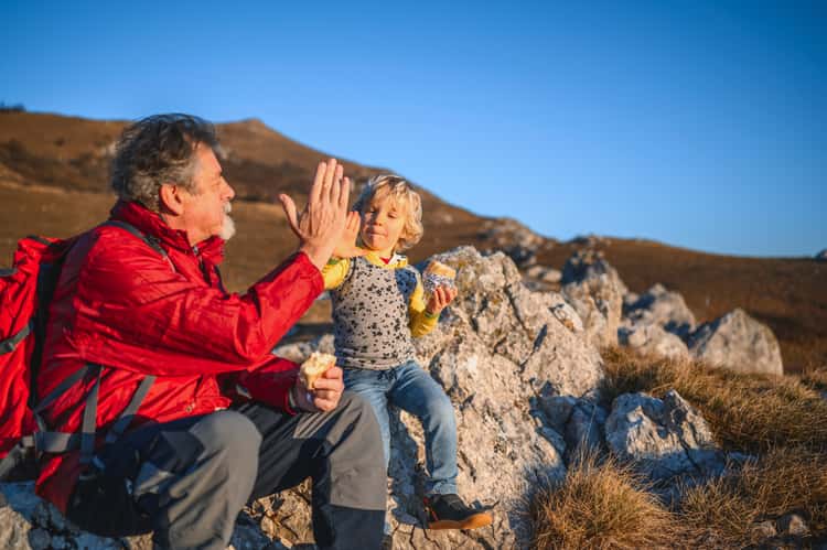 JJ_Photo_Grandpa_and_grandson_highfive_in_the_mountains_GettyImages_1212259365_1Star JJ_Photo_Grandpa_and_grandson_highfive_in_the_mountains_GettyImages_1212259365_1Star