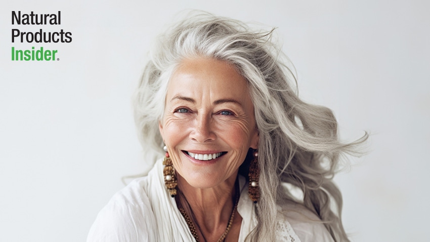 older woman smiling on a gray background, healthy aging 